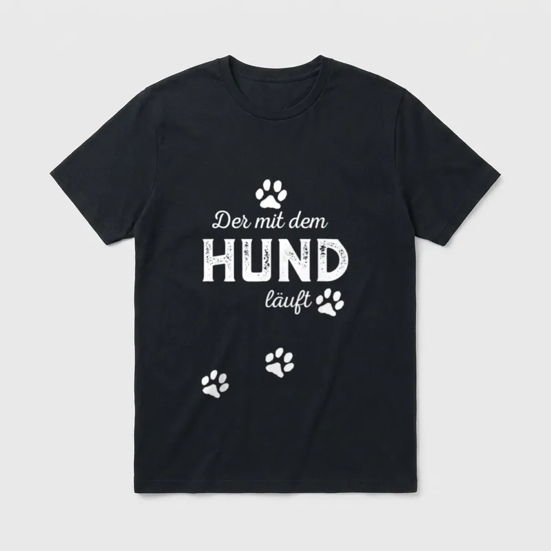 Der mit dem Hund T-Shirt 1392 – Schriftzug Der mit dem HUND läuft mit weißen Pfotenabdrücken – Klassisches T-Shirt in Schwarz
